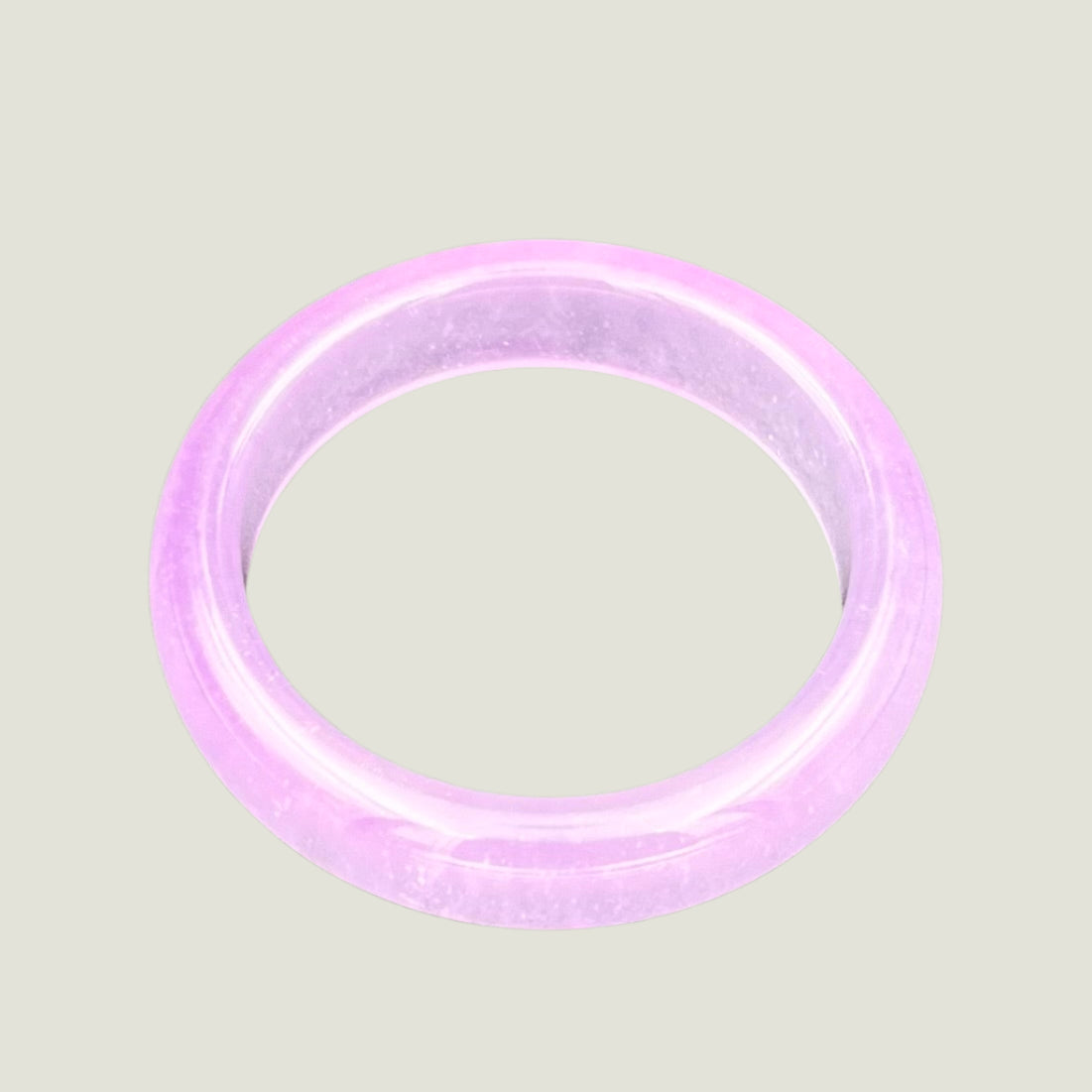Purple bracelet on a gray background